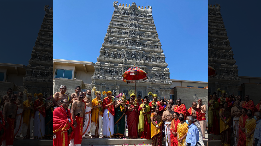 A small group standing outside of the Parashakti Temple in Pontiac, Michigan